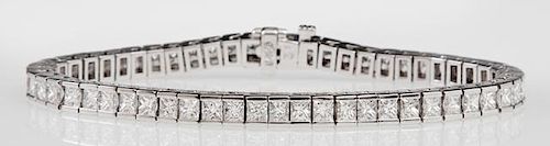 14K White Gold Tennis Bracelet, each of the fifty-six links with a princess cut diamond, total diamond weight- 8.55 carats, L