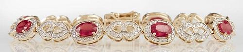 14K Yellow Gold Link Bracelet, with eight oval links with a central oval ruby atop a frame of tiny round diamonds, joined by 