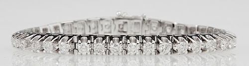 14K White Gold Tennis Bracelet, each of the 37 links mounted with a round diamond, total diamond weight- 7.81 cts., L.- 7 1/2