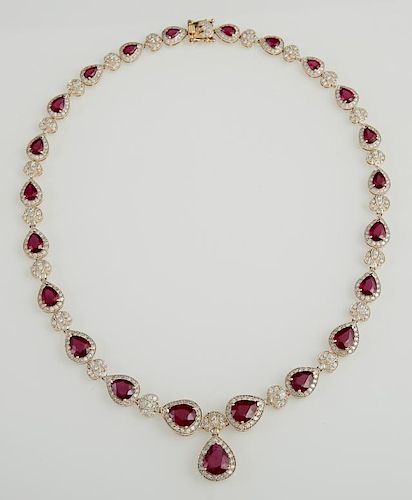 14K Yellow Gold Link Necklace, each of the 22 links with a graduated pear shaped ruby atop of border of round diamonds, joine