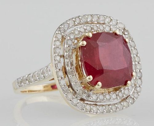 Lady's 14K Yellow Gold Dinner Ring, with a 8.27 carat cushion cut ruby atop two pierced concentric graduated borders of round