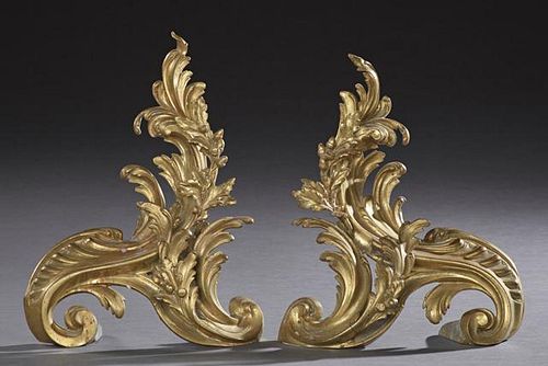 Pair of French Gilt Bronze Art Nouveau Chenets, c. 1900, of scrolled form, with relief floral, acorn and leaf decoration, H.-