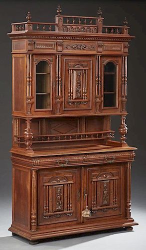 French Henri II Style Buffet a Deux Corps, 19th c., the spindled breakfront crest above a stepped crown over cupboard door wi
