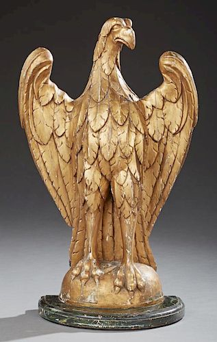Large American Carved Gilt and Gesso Wood Standing Eagle, 19th c., on an integral stepped faux marble demilune base, H.- 33 i