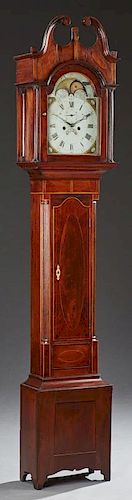 American Federal Inlaid Mahogany Tallcase Clock, early 19th c., the broken arch scrolled pediment over a glazed door, enclosi