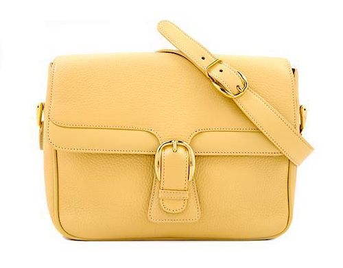 * A Gucci Pale Yellow Leather Flap Handbag, 10" x 8" x 3"; Strap drop: 20".