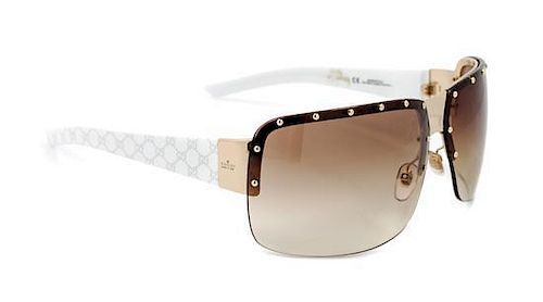 A Pair Of Gucci Sunglasses,