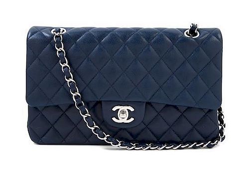 A Chanel Navy Caviar Classic Double Flap Handbag, 10" x 6" x 2.5"; Strap Drop: 9.5".