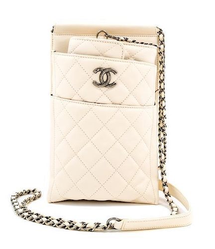 A Chanel Cream Leather Cross Body Pouch with Wallet, Bag: 5.5" x 10" x 1.5"; Wallet: 7.5" x 4.5" x 1.5".