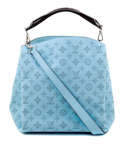 A Louis Vuitton Blue Selene Cross Body Satchel, 11" x 12" x 7"; Handle drop: 4"; Strap drop: 18".