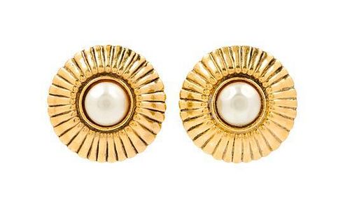 A Pair of Chanel Goldtone Earclips, 1.25" circumference.