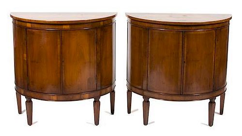 A Pair of Biedermeier Style Walnut Demilune Side Cabinets Height 33 x width 33 x depth 17 1/2 inches.
