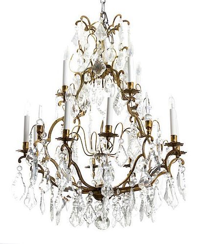 A Louis XV Style Bronze and Colorless Glass Twelve-Light Chandelier Diameter 26 inches.