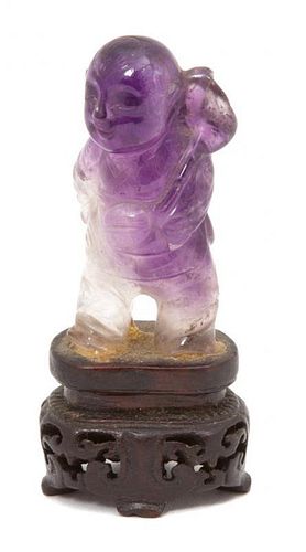 A Chinese Amethyst Carving of a Boy Holding a Palm Leaf Height 2 inches.