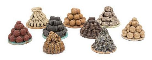 Nine Chinese Tromp-l'Oeil Glazed Ceramic Stacks of Nuts Height of tallest 3 inches.
