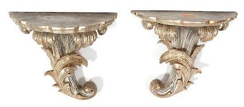 A Pair of Carved Silvered Wood Wall Brackets Height 10 3/4 x width 12 1/4 x depth 7 1/2 inches.