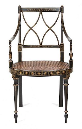 A Regency Ebonized and Gilt Decorated Lady's Open Armchair Height 34 1/2 inches.