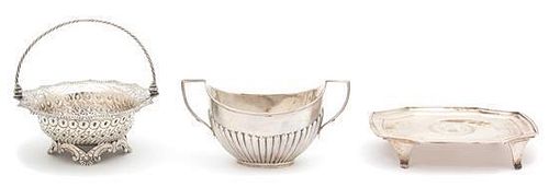 Three English Silver Articles, London, 1769, 1805 and 1895., comprising a reticulated footed basket with swing handle, a foot