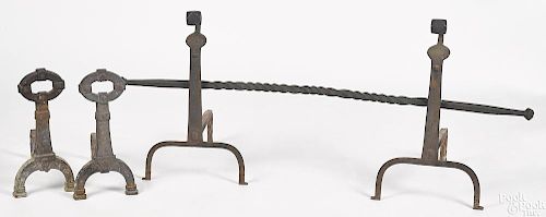 Two pairs of cast and wrought iron andirons