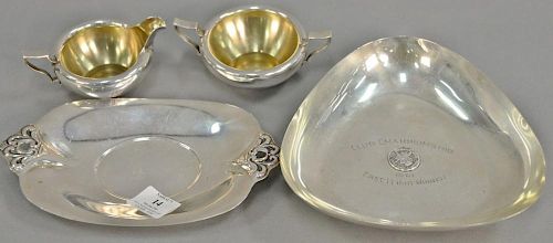 Sterling silver five pieces with dishes (lg. 7 1/2 in. & 9 in.), pourer, cream, and sugar. 27 troy ounces   Provenance: The E