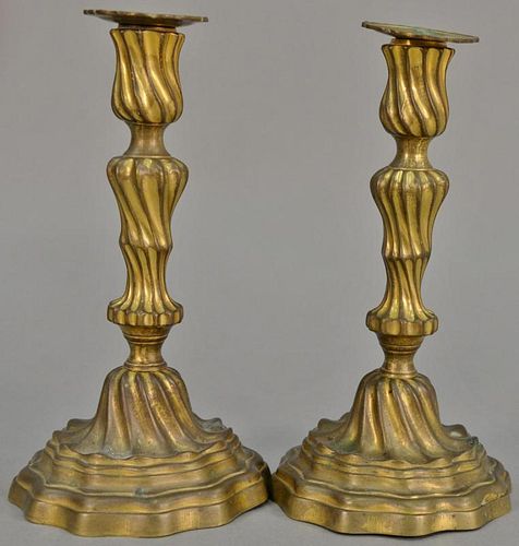 Pair of Continental candlesticks retaining some original gilt, probably 18th century. ht. 9 3/4in.   Provenance: The Estate o