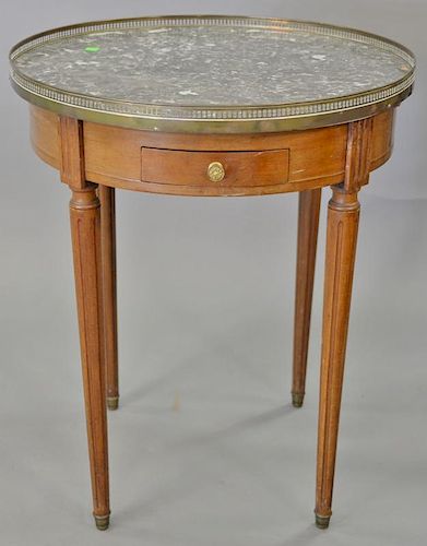 Louis XVI style round marble top table having two drawers.   Provenance: The Estate of Thomas F Hodgman of Fairfield, Connect
