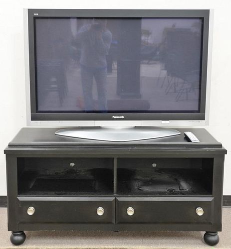 Two piece lot to include Panasonic flat panel 50 inch TV and stand (wd. 54 in.).   Provenance: The Estate of Thomas F Hodgman