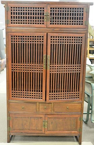 Chinese style cabinet in two parts having six doors and three drawers. ht. 86 in., wd. 48 in.