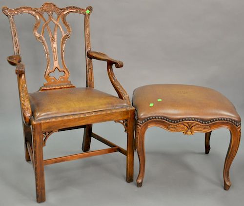 Two piece lot to include chippendale style armchair and ottoman with leather seat and top.