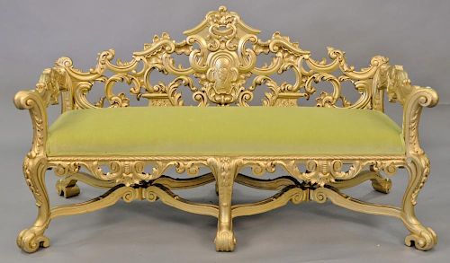 Gold painted carved loveseat. wd. 66 in.