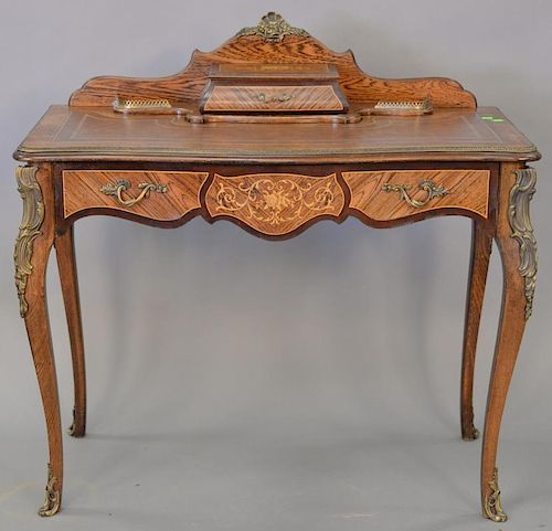 Louis XV style leather top desk with metal mounts. ht. 37 in., top: 18" x 38"