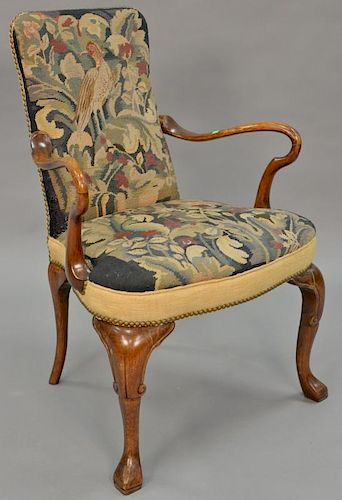 Queen Anne style open armchair with needlepoint upholstery.