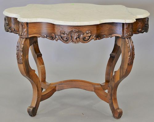 Rosewood Victorian shaped marble top center table. ht. 29 in., top: 29" x 40"