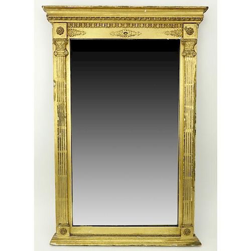 Early 20th Century Italian Louis XVI Style Giltwood Mirror. Carved scroll motif on apron with two c