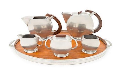 Art Deco, Holland, a tea and coffee service, comprising a tea pot, coffee pot, creamer, sugar, covered dish and tray