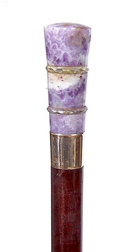 25. Amethyst Dress Cane- Ca. 1920- A well colored amethyst hardstone handle with a pair of rock crystal faceted rings, karat