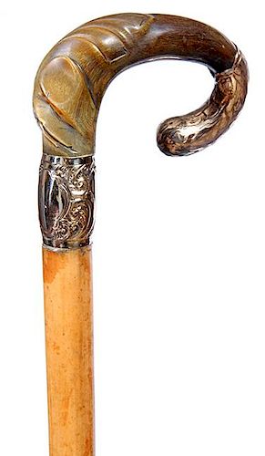 35. Victorian Horn Dress Cane- Ca. 1875- A prime example of a Victorian twisted horse and gold-filled handle, malacca shaft