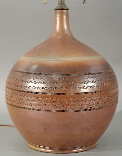 19th century stoneware pottery vase with incised fish and tribal decorated band, made into a table lamp. 
height 24 inches