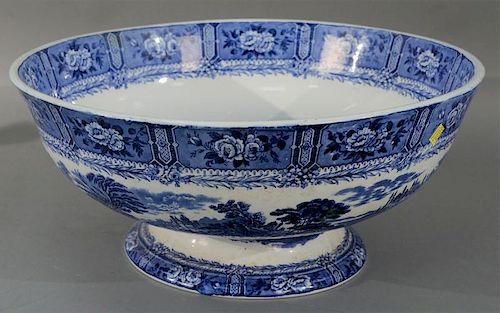Large English blue and white footed punch bowl having transferware decorated flower panels and landscape scenes (spider crack