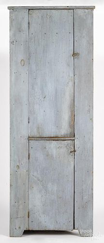 New England painted pine one-piece corner cupboard