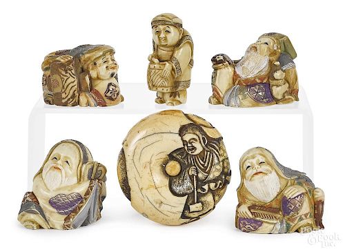 Four Japanese carved and painted ivory netsukes