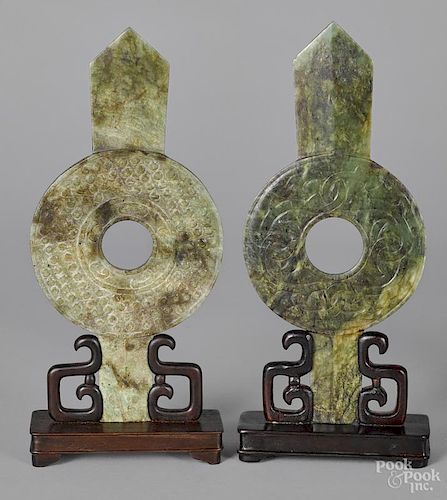Two Chinese carved spinach jade bi-disc plaques