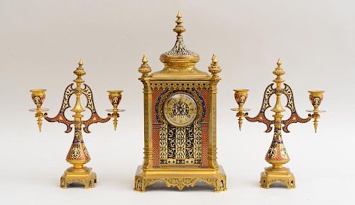 FRENCH BRASS MOUNTED CHAMPLEVÉ ENAMEL THREE-PIECE CLOCK GARNITURE, IN THE MOORISH STYLE, RETAILED BY TIFFANY & CO., NY