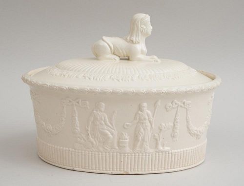 CONTINENTAL IVORY-GLAZED FAIENCE RELIEF-DECORATED TUREEN AND COVER