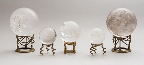TWO PAIRS OF ROCK CRYSTAL SPHERES AND A SINGLE SPHERE