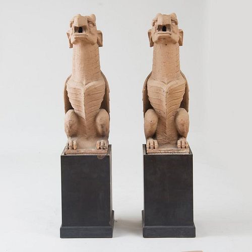 PAIR OF TERRACOTTA-COLORED COMPOSITION WINGED GRIFFIN GARGOYLES