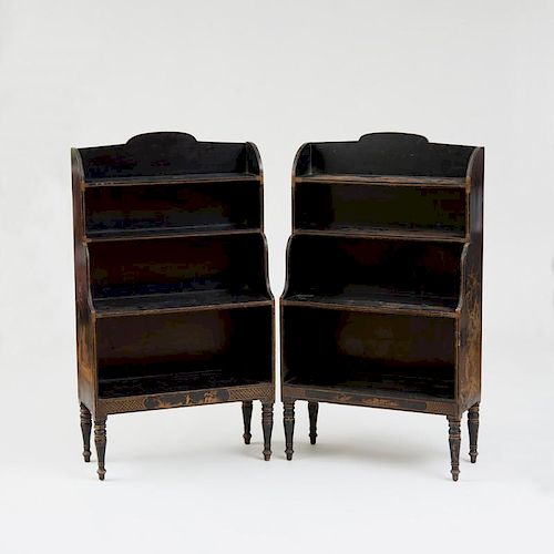 TWO NEARLY IDENTICAL REGENCY STYLE BLACK-PAINTED AND PARCEL-GILT OPEN BOOKCASES