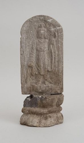 SOUTHEAST ASIAN RELIEF CARVED STONE STELE, FITTED ON LOTUS-FORM STAND