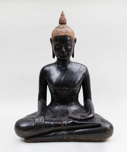 THAI CARVED AND BLACK-PAINTED WOOD FIGURE OF THE SEATED BUDDHA
