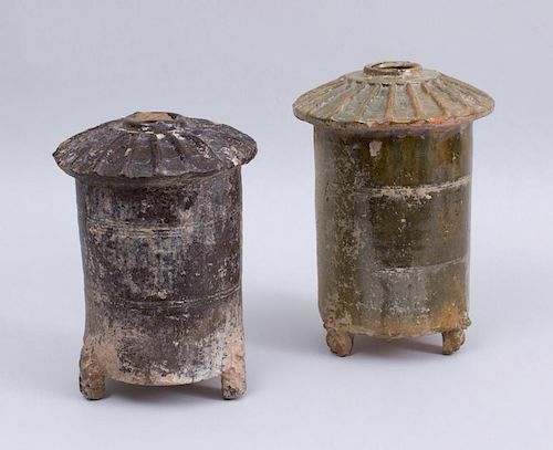 TWO HAN TYPE GLAZED POTTERY CYLINDRICAL TRIPOD BARNS